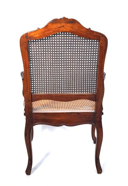 null Louis XV style caned armchair in carved and moulded wood with rocaille decoration

H....