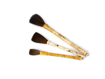 null CHINA - Set of three large calligraphy brushes made of carved and sculpted bone...