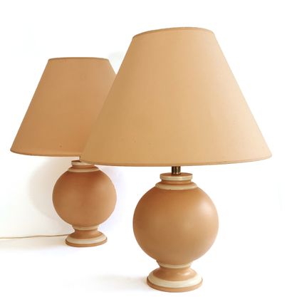 null Pair of modern earthenware table lamps in the shape of a sphere on a pedestal

Circa...