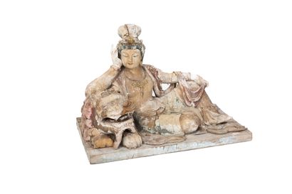 null China, 19th century 

Wooden figure of Guanyin, reclining in a relaxed position,...