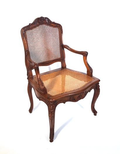 null Louis XV style caned armchair in carved and moulded wood with rocaille decoration

H....