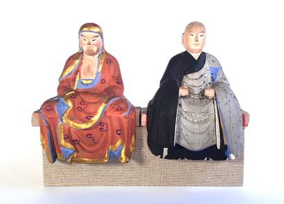 null CHINA - Pair of seated dignitaries in polychrome carved wood

H. 13,5 cm

Wear...