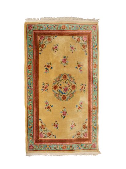 null Carpet China Tientsin mid 20th century

Golden yellow background with multicolored...