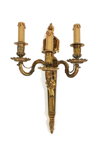 null Three lights wall lamp in chased and gilded bronze; the bobèches with godrons;...