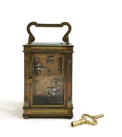 null Officer's clock, the brass cage and bevelled glasses surmounted by a handle,...