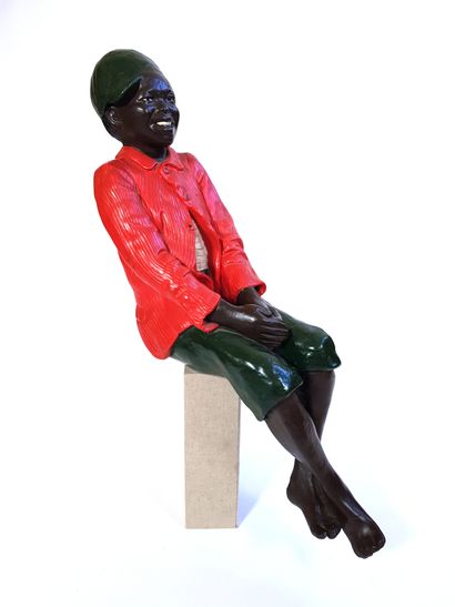null Sculpture en résine polychrome figurant un jeune homme noir assis dans le style...