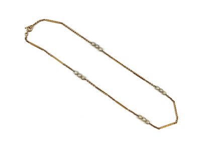 null Chain in yellow gold 18K (750 thousandths) with mesh forçat and chiselled sticks,...