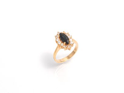 null Yellow gold ring 18 K (750 thousandths) decorated with a sapphire navette cut...