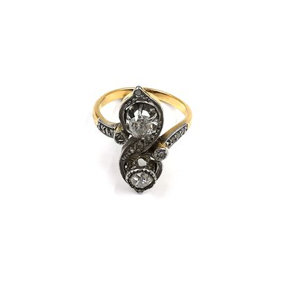 null Two-tone gold "toi et moi" ring set with two round old-cut diamonds in a rose-cut...