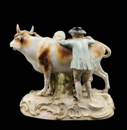 null MEISSEN 

Porcelain group representing a couple of peasants around a cow on...