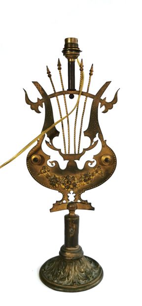 null An ormolu and chased bronze lamp stand, the shaft in the form of a lyre decorated...