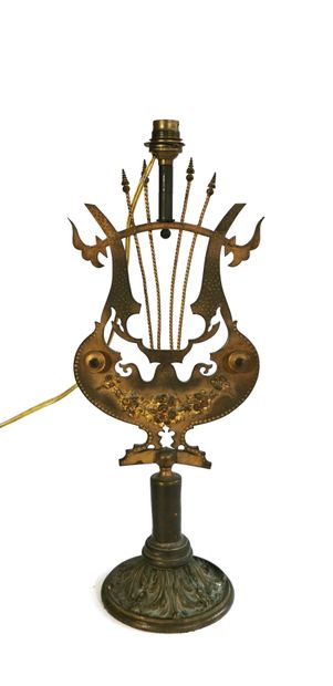 null An ormolu and chased bronze lamp stand, the shaft in the form of a lyre decorated...