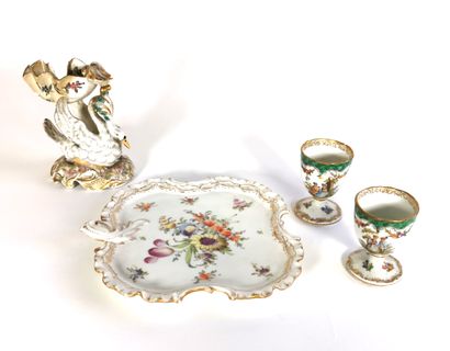 null Porcelain set including two egg cups, a tray and a dish held by a swan

Three...