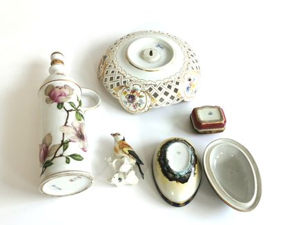 null Polychrome porcelain set including a bottle, a display stand, an egg forming...