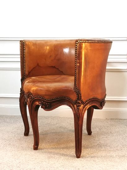 null Moulded and carved beechwood desk chair, faded tan leather upholstery

H. 71...