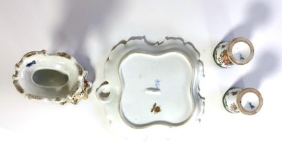 null Porcelain set including two egg cups, a tray and a dish held by a swan

Three...