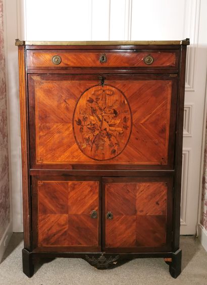 null Secretary inlaid with attributes of love and music in a medallion on a rosewood...