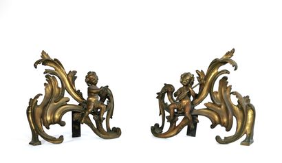 null A pair of chased and gilt bronze andirons with a love design on a rocaille background

Without...