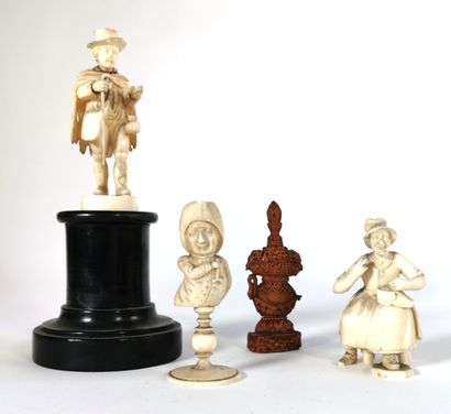 null A pilgrim figurine and two grotesque figurines in resin

One bottle carved in...