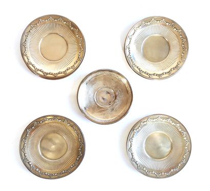 null Twelve first-title vermeil saucers decorated with flowery garlands

Three silver...