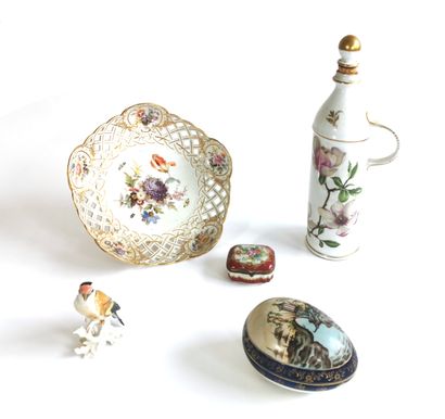 null Polychrome porcelain set including a bottle, a display stand, an egg forming...