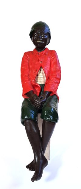 null Polychrome resin sculpture of a young black man sitting in the style of the...