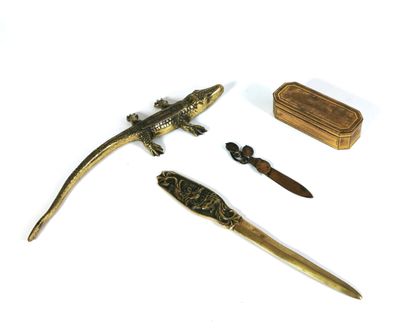 null Set of pieces in gilded metal or bronze including two paper-cutters, one signed...