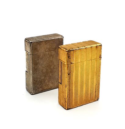 Two lighters, one in gilded metal with grooves...