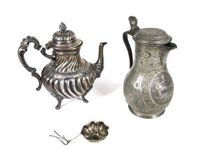 null A silver plated teapot with gadrooned patterns and a pewter pot with crowned...