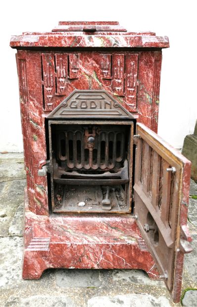 null GODIN, circa 1930

Stove in cast iron with painted marbled decoration opening...