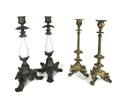 null Pair of tripod candlesticks in chased and gilded bronze with foliage and feline...