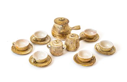 null THE TRISKEL

Earthenware coffee set with striated pattern and material effects...