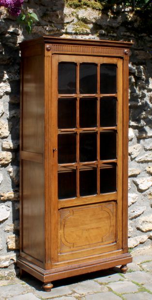 null Louis XVI style rustic showcase in natural wood with a glass door opening to...