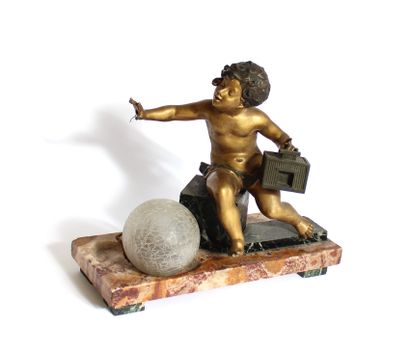 null Table lamp in regula, marble and glass with a putti holding in his left hand...