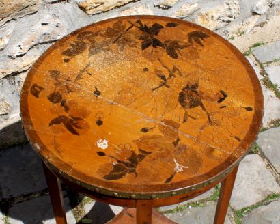 null Pedestal table with inlaid decoration of foliage, the plate with belt encircled...