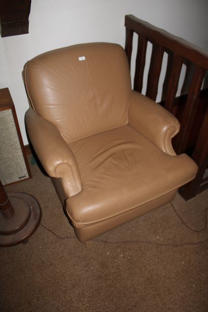 null A corner chair and a leather chair