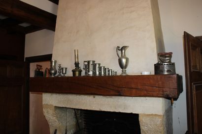 null Set of twelve pewter pieces, two antique irons and an oil lamp