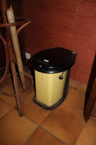 null A trash can in the shape of a toilet bowl