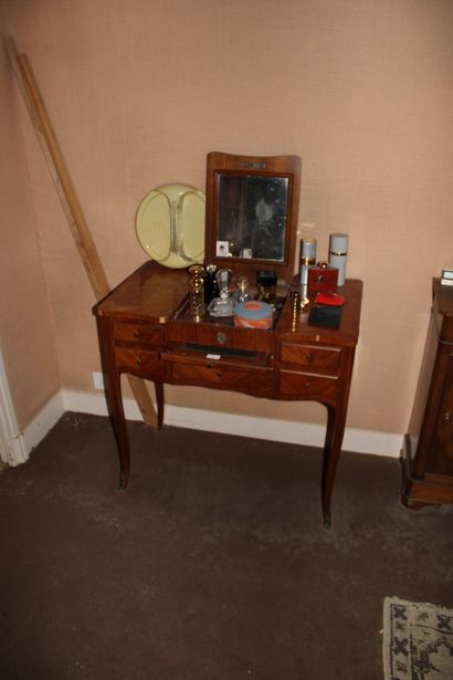 null Dressing table in wood veneer with perfume bottles and mirror of toilet year...