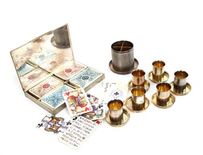 null HERMÈS House

Silver and gilt game set including a box for playing cards, six...