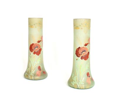 null WORK AROUND 1900

A pair of stained glass vases with a flared base and a high...