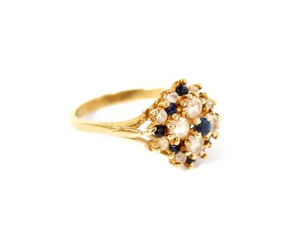 null Yellow gold ring 14K (585 thousandths) with stylized flower set with small sapphires...