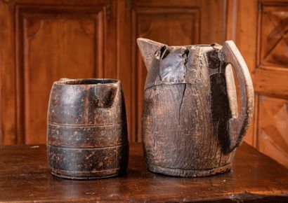 null Two wooden milk jugs

H. 20 and 29 cm