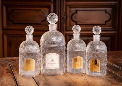 null GUERLAIN House - Habit Rouge

Suite of four molded glass bottles with bees decoration,...