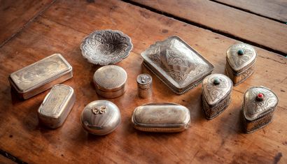 null OBJECTS OF DISPLAY

Set of ten pill boxes with engraved decoration and a silver...