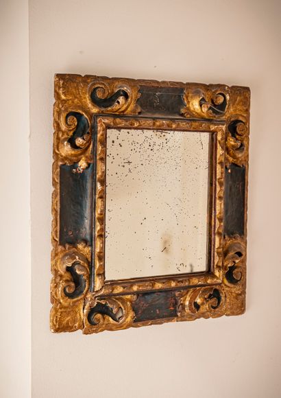Frame in molded and carved wood, the corners...