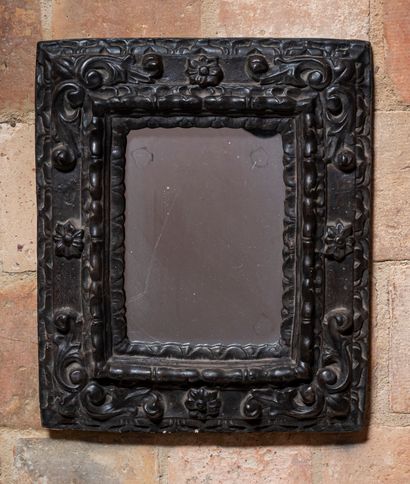 null Louis XIII style mirror in terracotta with brown patina and decorated with flowers...