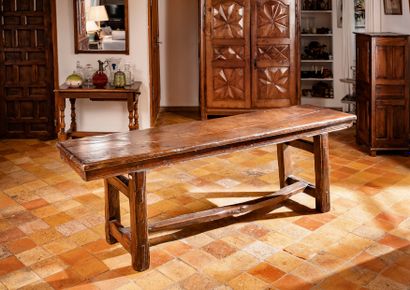 Community table in molded oak, the top resting...
