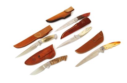 null Moulton, five hunting knives, steel blades signed, polished wooden handles with...