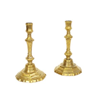 null Pair of gilt bronze candlesticks with chased motifs of flowers and scrolls 
Work...